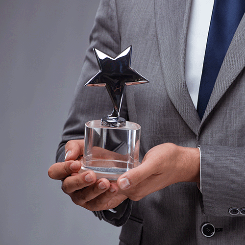 Business Person Holding a Corporate Star Award